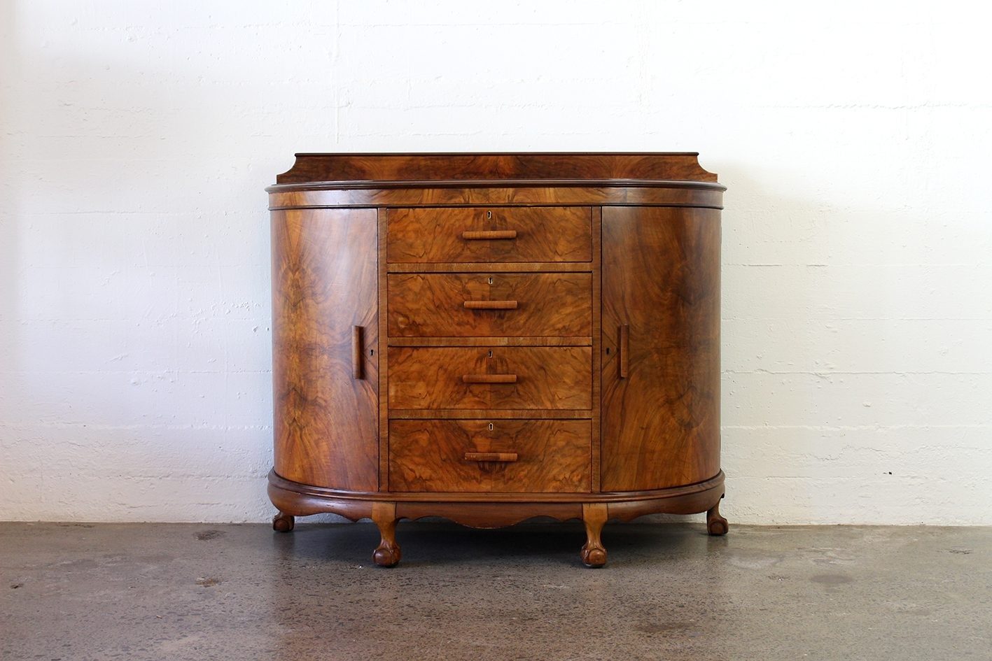 Curved walnut chest