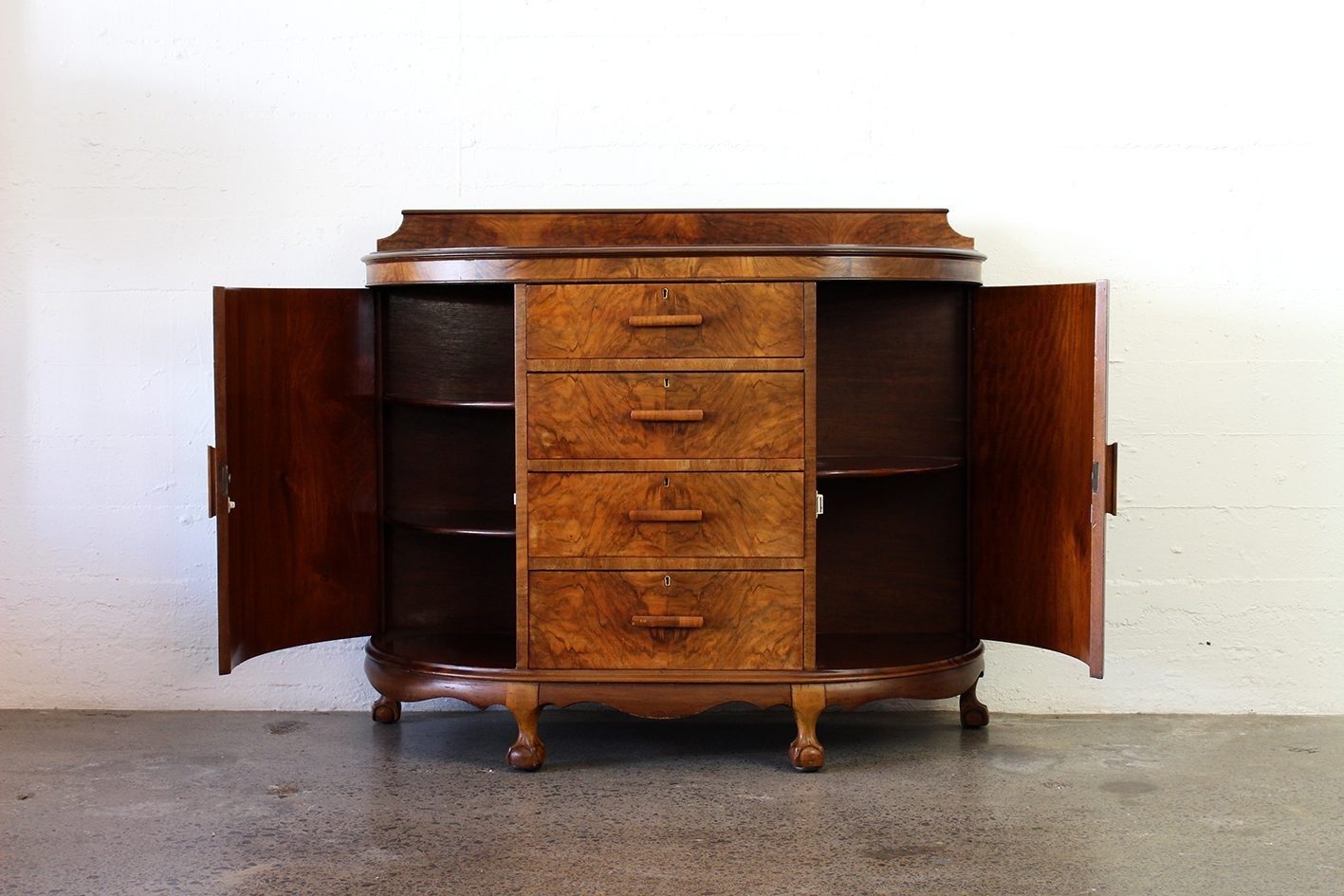 Curved walnut chest