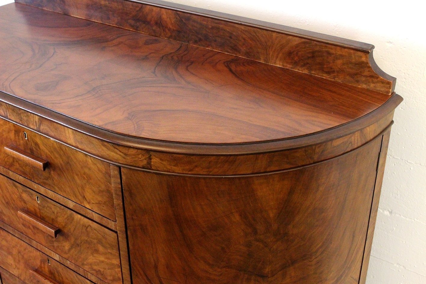 Curved walnut chest